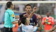 Marseille's Argentinian forward Lucas Ocampos (down) falls after an altercation with Paris Saint-Germain's Brazilian forward Neymar (up) during the French L1 football match between Marseille (OM) and Paris Saint-Germain (PSG) on October 22, 2017, at the V