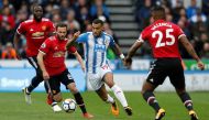 Huddersfield Town’s Danny Williams in action with Manchester United's Antonio Valencia and Juan Mata Action Images via Reuters/Ed Sykes  
