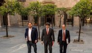 Catalan regional government president Carles Puigdemont (C) arrives with Catalan regional vice president and chief of economy and finance Oriol Junqueras (L) and Catalan government spokesperson Jordi Turull to attend a regional goverment meeting at the Ge