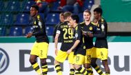 Borussia Dortmund’s Alexander Isak celebrates scoring their second goal with Shinji Kagawa, Maximilian Philipp and team mates REUTERS/Hannibal Hanschke  
