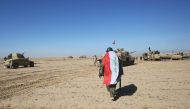 Iraqi forces supported by popular paramilitaries prepare to advance towards the village of Sheikh Younis, south of Mosul on February 19, 2017.  (AFP / Ahmad Al-Rubaye) 