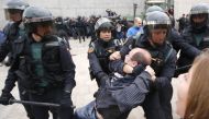 Spanish Guardia Civil guards drag a man outside a polling station in Sant Julia de Ramison, October 1, 2017 on the day of a referendum on independence for Catalonia banned by Madrid (AFP / Raymond Roig) 