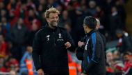 Liverpool manager Juergen Klopp and Huddersfield Town manager David Wagner share a joke during the match Action Images via Reuters/Craig Brough  
