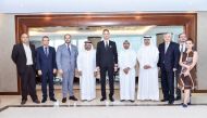 Sheikh Faisal bin Qasim Al Thani (fourth left), QBA Chairman; Ilan Laufer (fourth right), Romanian Minister for Business Environment, Commerce and Entrepreneurship; and Dr Cristian Tudor (third left) Ambassador of the Republic of Romania to Qatar along wi