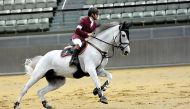 Hamad Nasser Al Qadi, astride  St Lucia during the two-phased 130-140cm class in Big Tour competition of Hathab Series at Al Shaqab Arena yesterday. Pictures: Lotfi Garsi
