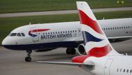FILE PHOTO: British Airways planes are parked at Heathrow Terminal 5 in London, Britain May 27, 2017. REUTERS/Neil Hall/File Photo