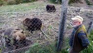 This photograph taken on October 16, 2017, Ivan Crnkovic-Pavenka gestures as he speaks at his shelter for brown bears in the village of Kuterevo.  AFP / STR