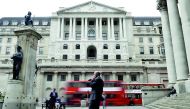 A man talks on a mobile phone as people walk past the Bank of England, in London, Britain September 21, 2017. Reuters/Mary Turner