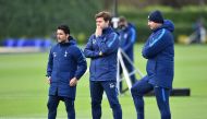 A file photo of Tottenham Hotspur's Argentinian head coach Mauricio Pochettino (C) stands with assistant manager Jesus Perez (L) during a training session at Tottenham Hotspur's Enfield Training Centre, on October 31, 2017 on the eve of their UEFA Champio
