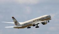 A file photo of an Etihad Airways Boeing 777-3FX company aircraft taking off. REUTERS/Jacky Naegelen