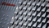 FILE PHOTO: A logo of Alibaba Group is seen on a building under construction, where the company's Beijing headquarters will be, in Beijing, China, October 15, 2015. REUTERS/Kim Kyung-Hoon/File Photo 
