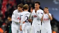 Tottenham Hotspur's English midfielder Dele Alli (2nd R) and teammates celebrate their win on the pitch after the UEFA Champions League Group H football match between Tottenham Hotspur and Real Madrid at Wembley Stadium in London, on November 1, 2017. Tot