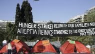 A group of refugees stage a protest, demanding to reunion with their families, in front of the parliament building in Athens, Greece on November 02, 2017.  Ayhan Mehmet - Anadolu Agency 

