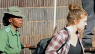 A file photo of US citizen Martha O'Donovan being led into a remand truck outside court in Harare, Zimbabwe November 4, 2017. REUTERS/Philimon Bulawayo