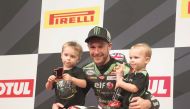 British WorldSBK World champion Jonathan Rea poses for photographs with his sons Jake and Tyler after winning the second successive race at the floodlit-Losail International Circuit (LIC) yesterday. 