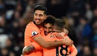 Liverpool's Egyptian midfielder Mohamed Salah (C) celebrates after scoring with Liverpool's German midfielder Emre Can (L) and Liverpool's Spanish defender Alberto Moreno during the English Premier League football match between West Ham United and Liverpo