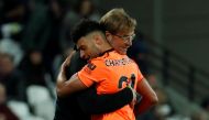Liverpool’s Alex Oxlade-Chamberlain hugs Liverpool manager Juergen Klopp as he is substituted off REUTERS/Eddie Keogh  
