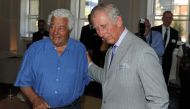 Britain's Prince Charles (R) greeting renowned local chef Antonio Carluccio as he tours the restored historical State Buildings in Perth on November 15, 2015. AFP / Greg Wood