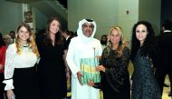 Nasser Al Ansari (centre), Chairman, Just Real Estate (JRE), with Katharine Pooley (second right), and other guests, at the function hosted for thea special signing ceremony of the book “Journey By Design”, at the JRE sales centre in Doha. Pic: Salim Matr