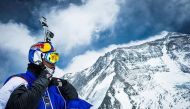 Russian base jumper Valery Rozov is pictured preparing to jump off the north face of Mount Everest into Tibet in China on May 5, 2013. / AFP.