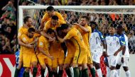 Australia’s Mile Jedinak celebrates scoring a goal with team mates REUTERS/Steve Christo
