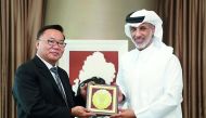 Qatar Football Association (QFA) President, Sheikh Hamad bin Khalifa bin Ahmed Al Thani handing over a memento to President of the Oceania Football Confederation (OFC) David Chung in Doha yesterday.