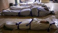The bodies of Syrian children who died following reported shelling by Syrian government forces lie in a makeshift morgue in the rebel-held town of Douma in Syria's eastern Ghouta region, on November 17, 2017. AFP / Amer Almohibany