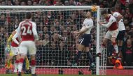 Arsenal's German defender Shkodran Mustafi (2R) heads the ball to score the opening goal during the English Premier League football match between Arsenal and Tottenham Hotspur at the Emirates Stadium in London on November 18, 2017. (AFP / Daniel LEAL-OLIV