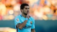 Barcelona's Uruguayan forward Luis Suarez celebrates after scoring a goal during the Spanish league football match Leganes vs Barcelona at the Butarque stadium in Leganes on November 18, 2017. / AFP / OSCAR DEL POZO