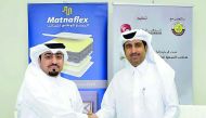 Saleh bin Hamad Al Sharqi (right), QC Director General; and Fahd Al Emadi, Matnaflex CEO shaking hands after signing the sponsorship agreement, on Thursday.