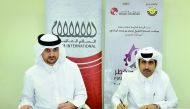 Saleh bin Hamad Al Sharqi (right), Qatar Chamber Director-General; and Abdul Salam Abu Issa, Salam International’s CEO, signing the sponsorship deal, yesterday at Qatar Chamber headquarters.