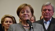 German Chancellor and leader of the Christian Democratic Union (CDU) party, Angela Merkel, closes her eyes while speaking after exploratory talks on forming a new government broke down on November 19, 2017 in Berlin. AFP / Tobias SCHWARZ
