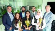 QPAY officials with the  awards it received at Middle East Cards and Payments Awards.