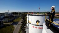 A worker is seen at the central processing facility of the Rosneft-owned Priobskoye oil field outside the West Siberian city of Nefteyugansk, Russia, August 4, 2016. Reuters/Sergei Karpukhin