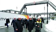 Russian Prime Minister Dmitry Medvedev (C) and Rosneft Chief Executive Igor Sechin (L) inspect production facilities at the Kondinsky group of oil fields in Khanty-Mansi Autonomous District - Yugra, Russia November 21, 2017. Sputnik/Alexander Astafyev/Reu