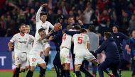 Sevilla’s Guido Pizarro celebrates scoring their third goal with coach Eduardo Berizzo and team mates. Reuters/Matthew Childs
