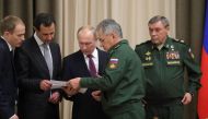 Russian President Vladimir Putin (C), Syrian President Bashar al-Assad (2nd L), Russian Defence Minister Sergei Shoigu (2nd R) and Chief of the General Staff of Russian Armed Forces Valery Gerasimov (R) attend a meeting in the Black Sea resort of Sochi, R