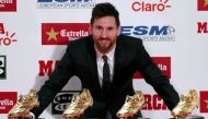 Barcelona's Lionel Messi poses with his four Golden Boot trophies during a ceremony in Barcelona, Spain, November 24, 2017. REUTERS/Albert Gea TPX IMAGES OF THE DAY
