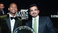 Qatar Olympic Committee President H E Sheikh Joaan bin Hamad Al Thani with Mutaz Essa Barshim after he won the World Athlete of the Year 2017 trophy at the IAAF Awards in Monaco on Friday. RIGHT: Barshim poses for photographs with IAAF President Sebastian