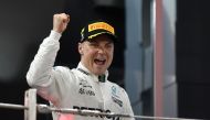 Mercedes' Finnish driver Valtteri Bottas celebrates at the end of the Abu Dhabi Formula One Grand Prix at the Yas Marina circuit on November 26, 2017. / AFP / Andrej ISAKOVIC