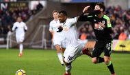 Swansea City's Jordan Ayew in action with Bournemouth's Adam Smith. REUTERS/Dylan Martinez 