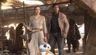 A still of the actors Daisy Ridley and John Boyega from the movie Star Wars: The Force Awakens.