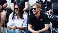 FILE PHOTO: Britain's Prince Harry and his girlfriend actress Meghan Markle watch the wheelchair tennis event during the Invictus Games in Toronto, Ontario, Canada September 25, 2017. REUTERS/Mark Blinch/File Photo