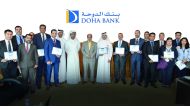 Dr R Seetharaman (centre), CEO Doha Bank; along with senior officials and employees of Doha Bank during the employee recognition awards event, at Doha Bank Tower in West Bay.