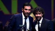 Juventus' Italian goalkeeper Gianluigi Buffon (L) poses with poses with AIC President Damiano Tommasi after receiving the 