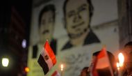 Egyptians hold candles at a vigil outside the Syndicate of Journalists in the capital Cairo's downtown district on November 27, 2017, in the memory of the victims of a bomb and gun assault that left over 300 worshippers killed in the restive province of N