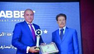 QIB Group CEO, Bassel Gamal (left) receiving the Arab Best Award during a ceremony held in Morocco.