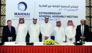 Sheikh Suhaim bin Abdullah Al Thani, Vice-Chairman of Mannai Corporation (fourth left) with other board members and officials during the Extraordinary General Assembly Meeting (EGM) at InterContinental Hotel-Doha, yesterday. Pic: Abdul Basit/The Peninsula