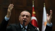 Turkey's President Tayyip Erdogan addresses members of parliament from his ruling AK Party (AKP) during a meeting at the Turkish parliament in Ankara, Turkey, December 5, 2017. REUTERS/Umit Bektas