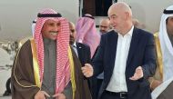 A photo release by the Kuwait news agency KUNA on December 6, 2017 shows Kuwaiti national assembly speaker Marzouq al-Ghanim (L) receiving FIFA president Gianni Infantino at Kuwait international airport in Kuwait City.   AFP / Kuwait News Agency 